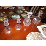 TUDOR CRYSTAL STOPPERED DECANTER, ONE OTHER DECANTER AND A PAIR OF CANDLESTICKS.