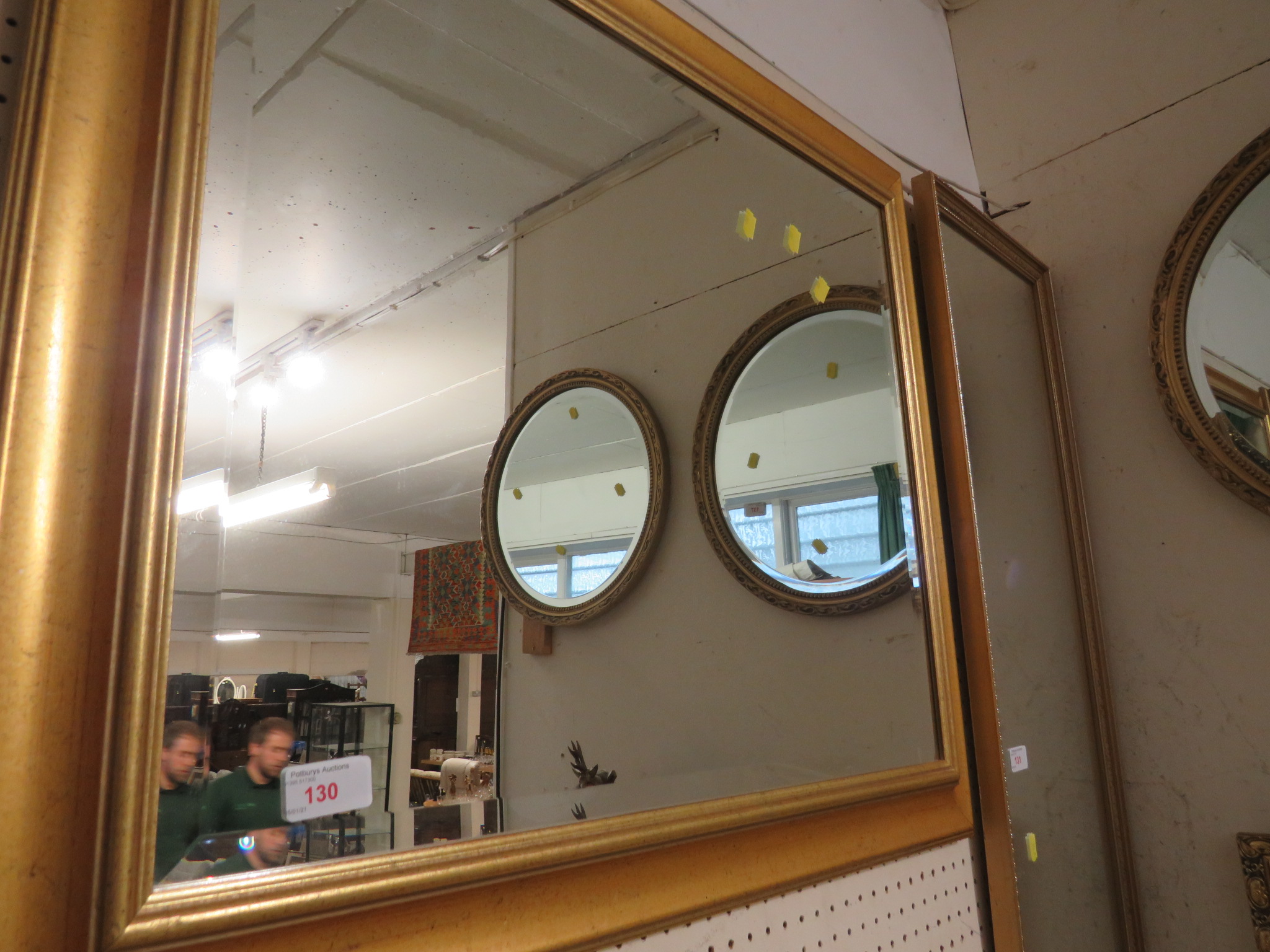 Rectangular bevelled wall mirror in gilt effect frame.