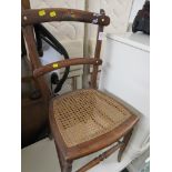 MID WOOD SIDE CHAIR WITH CANED SEAT.
