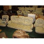 ERCOL MID ELM FRAMED THREE-SEATER SOFA AND A PAIR OF ARMCHAIRS WITH FLORAL CUSHIONS. (A/F)