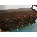 STAINED OAK LIFT TOP BLANKET BOX WITH LINENFOLD PANELS