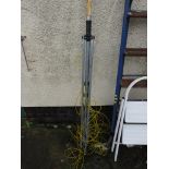 A WASHING LINE POLE TOGETHER WITH STANDING BASE. (AF)