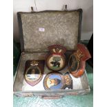 FOUR HAND-PAINTED PLAQUES MOUNTED ON WOOD, AND A SMALL FIBRE SUITCASE (AF)