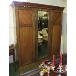 LARGE MAHOGANY THREE-DOOR WARDROBE WITH CENTRAL MIRROR DOOR AND FITTED LINEN DRAWERS AND SLIDES