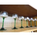 SET OF SIX STEMMED DRINKING GLASSES .