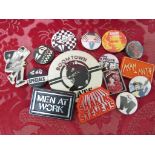 SMALL SELECTION OF VINTAGE PLASTIC AND TIN BADGES INCLUDING MADNESS, SPECIALS AND BOOMTOWN RATS.