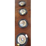 SET OF FOUR CRIES OF LONDON POT LIDS IN EBONISED EFFECT FRAMES.