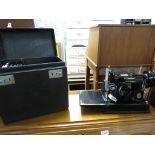 VINTAGE SINGER ELECTRIC SEWING MACHINE WITH CARRY CASE AND INSTRUCTION BOOKLET FOR MODEL 221K1