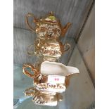 SADDLER POTTERY TEAPOT, MILK JUG , AND SUGAR BOWL WITH GOLD GLAZE