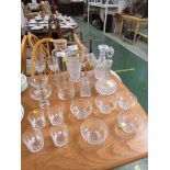 THREE CUT GLASS DECANTERS AND OTHER GLASS WARE.