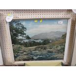 FRAMED AND GLAZED COLOURED PHOTOGRAPH DEPICTING RIVER AND STONE BRIDGE WITH MOUNTAINS BEYOND.