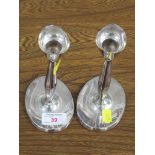 A PAIR OF WHITE METAL CLAD CANDLESTICKS, STYLIZED TULIP SHAPE ON OVAL FILLED BASES, STAMPED 830S