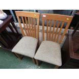 PAIR OF OAK FRAMED DINING CHAIRS.