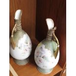 PAIR OF OVOID CERAMIC GARNITURE JUGS HAND DECORATED WITH ROSES ETC