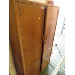 MID 20TH CENTURY LIGHT OAK TWO-DOOR FITTED WARDROBE.