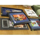 FOUR FRAMED AND GLAZED ITEMS OF ELVIS PRESLEY MEMORABILIA INCLUDING TICKET STUB, EP RECORDS AND
