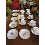 BONE CHINA SIX SETTING TEA SERVICE WITH GILT AND FLORAL DECORATION.