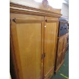 EDWARDIAN LIGHT OAK TWO-DOOR WARDROBE WITH BRASS HANDLES.