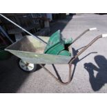 GALVANIZED METAL WHEELBARROW AND AN EVERGREEN LAWN SPREADER