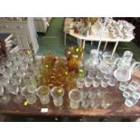 AMBER GLASS JUG AND DRINKING GLASSES AND OTHER GLASS WARE INCLUDING CARAFES.