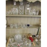 THREE DECANTERS, ASSORTED DRINKING GLASSES, GLASS BOWLS AND PAPERWEIGHT.