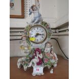 CONTINENTAL PORCELAIN MANTEL CLOCK WITH QUARTZ MOVEMENT.