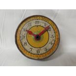 VINTAGE TIN PLATE COIN BANK IN THE FORM OF A CLOCK FACE.