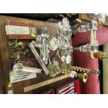A PAIR OF BRASS CANDLE STICKS , SILVER-PLATED CANDLE HOLDERS, CUTLERY AND METAL WARE.