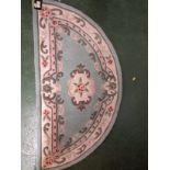 CHINESE STYLE DEMI-LUNE BLUE GROUND RUG (67 BY 127 CM)
