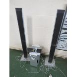 PANOSONIC SUB WOOFER, PAIR OF FLOOR STANDING SPEAKERS AND ONE OTHER SPEAKER.