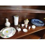 ONE SHELF OF DECORATIVE ITEMS INCLUDING STEM VASE AND FOUR DISPLAY PLATES.