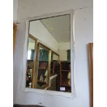 RECTANGULAR WALL MIRROR IN A PAINTED FRAME.