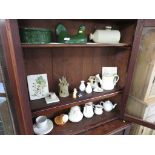 THREE SHELVES OF CHINA AND DECORATIVE ITEMS INCLUDING JUGS, FIGURINES ETC.