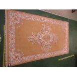 A MUSTARD GROUND RECTANGULAR RUG WITH FOLIATE MEDALLION BORDER. (AF)