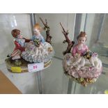 CONTINENTAL PORCELAIN FIGURAL GROUP OF BOY AND GIRL TOGETHER WITH ONE OTHER MATCHED FIGURINE OF GIRL