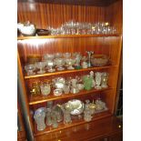 FOUR SHELVES OF PRESSED AND MOULDED GLASS INCLUDING SUNDAE DISHES VASES, BOWLS. TOGETHER WITH