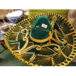 A SATURNO FIVE X SOMBRERO FINISHED IN GREEN AND GOLD.