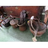 A CAST IRON KETTLE, A COPPER KETTLE, TWO COPPER SCUTTLES, PAIR OF SKEWERS, AND A CARVED WOODEN
