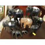 EIGHT CARVED WOODEN ELEPHANT FIGURINES.