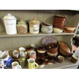 STONEWARE AND POTTERY STORAGE JARS, CASSEROLE DISHES, JUGS AND OTHER CERAMIC ITEMS (TWO SHELVES)