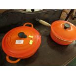 TWO LE CREUSET CAST IRON COOKING PANS WITH LIDS.