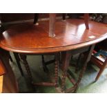 SMALL OAK OVAL GATE LEGGED TABLE ON BY TWIST SUPPORTS.