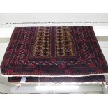 SMALL RED GROUND MIDDLE EASTERN PATTERNED CARPET WITH MULTIPLE MARGINS.