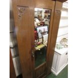 EARLY 20TH CENTURY OAK SINGLE DOOR WARDROBE WITH MIRROR PANEL.