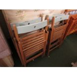 FOUR BEECH FRAMED FOLDING CHAIRS. (AF)