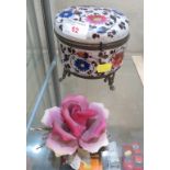 HAND-PAINTED GLASS AND BRASS DRESSING TABLE JAR ON FEET, TOGETHER WITH A PORCELAIN ROSE DECORATION.