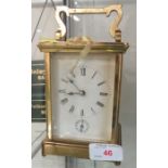 A BRASS CASED STRIKING CARRIAGE CLOCK.