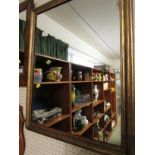 RECTANGULAR WALL MIRROR IN A GILT FRAME.