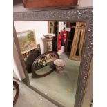 LARGE RECTANGULAR BEVELLED EDGED WALL MIRROR IN A SILVER COLOURED FRAME.