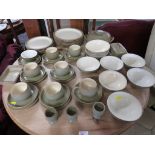 DENBY TEA AND DINNER WARE IN A PALE GREEN GLAZE.